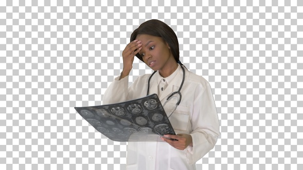 Young female doctor standing looking at, Alpha Channel