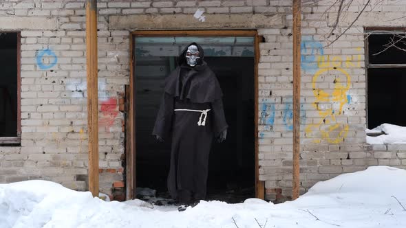 Grim Reaper in the Entrance of Derelict Building