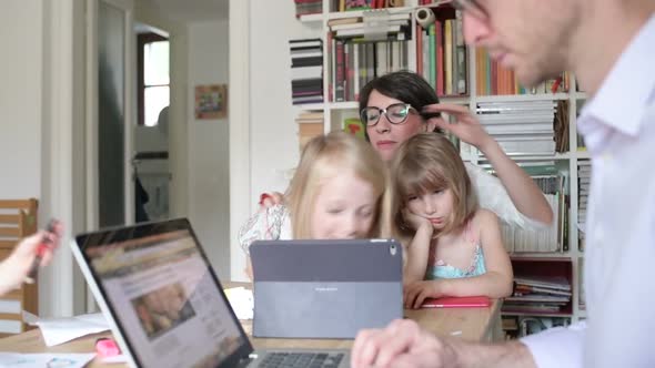 family with three children indoor using tablet - togetherness, technology, entertainment concept