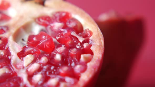 Slice of a Pomegranate on Red Background