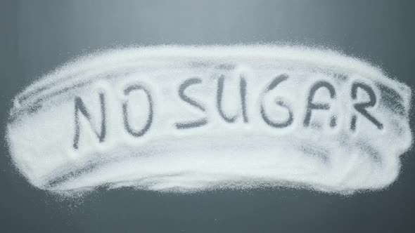 Text no sugar written on spilled sugar background