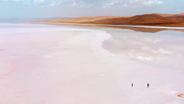 Aerial View Couple Walk On Tuz Salt Lake