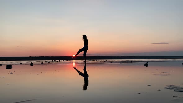 Free happy woman dancing and enjoying the sunset view.