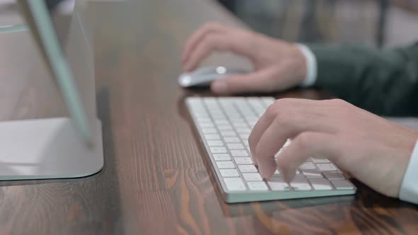 Close Up Shoot of Young Man Hand Using Mouse and Keyboard