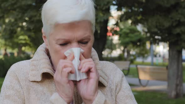 Allergic Middleaged Lady Feels Unwell Having Flu Symptom Ill Old Mature Woman Hold Tissue Sneezing