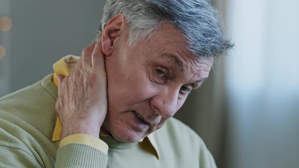 Sad Old Caucasian Man Suffer From Neck Pain 60s Upset Male Tired Grandfather Feel Ache in Spine Hurt