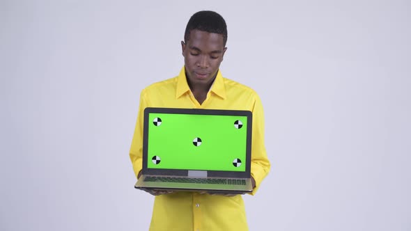 Young Stressed African Businessman Showing Laptop and Looking Sad