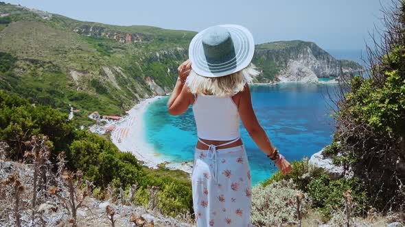 Beautiful Blond Women with Sun Hat Enjoying Beach Vacation at Kefalonia Island, Greece. Happiness