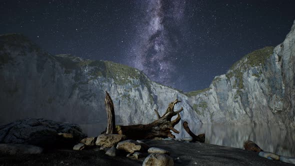 Hyperlapse of Night Starry Sky with Mountain and Ocean Beach in Lofoten Norway