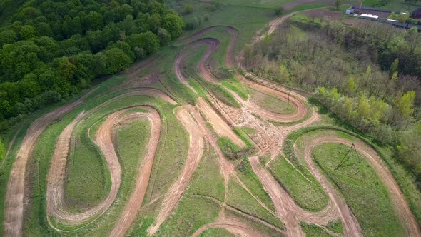 Dirt road tracks in field for motorcycle racing.