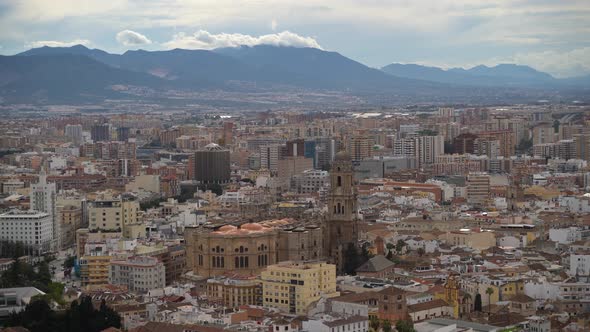 Panorama view over Malaga City with church and mountains in distance
