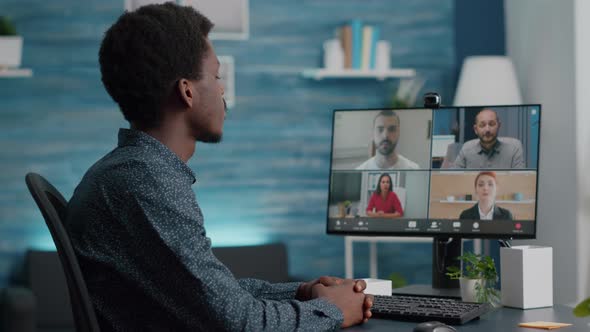 Selective Focus on African American Man on Online Conference Video Call