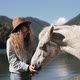 Woman Met a Wild Stallion on Vacation in the Mountains on a Lake Amazing View Turquoise Water High - VideoHive Item for Sale