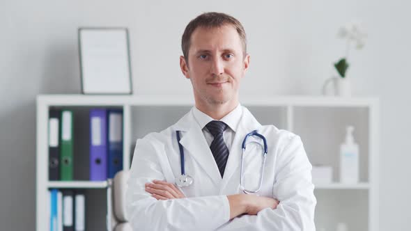 Professional medical doctor working in hospital office using computer technology.