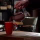 Cinematic Slow Motion Pouring Herbal Tea in Red Mug from Pink Tea Pot - VideoHive Item for Sale