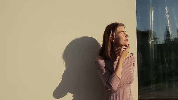 Smiling Young Woman on Rooftop During Sunny Day