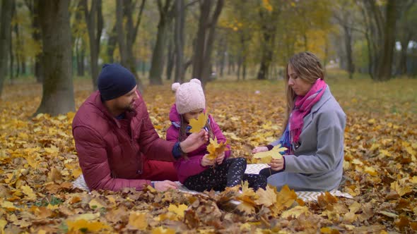 Family Enjoying Beautiful Autumn Day in Nature