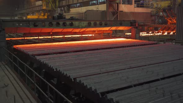 Steel Mill Steel Bars and Pipe Production Redhot Pipes Transported on Production Line Heavy Industry