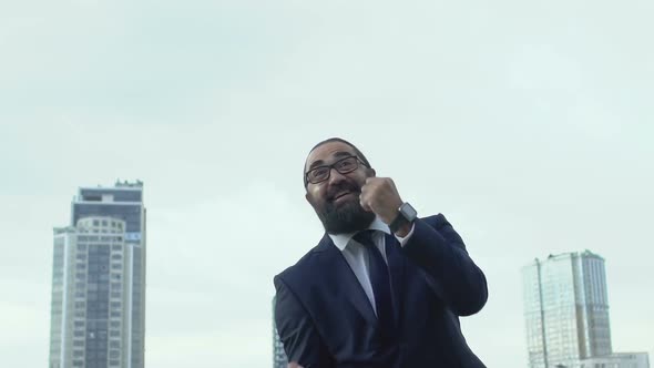 Motivated Man in Formalwear Making Yes-Gesture, Celebrating Successful Business