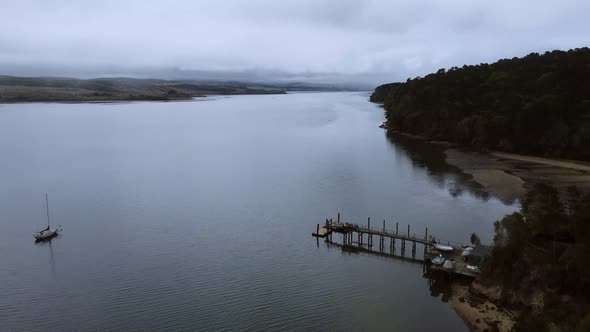 Drone Rising High Revealing Super wide Seascape Surrounded With Green Nature, California