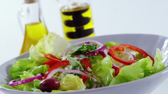 Oil being poured in salad