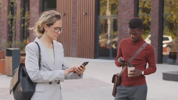 Multi-Ethnic Business People with Smartphones Outdoors