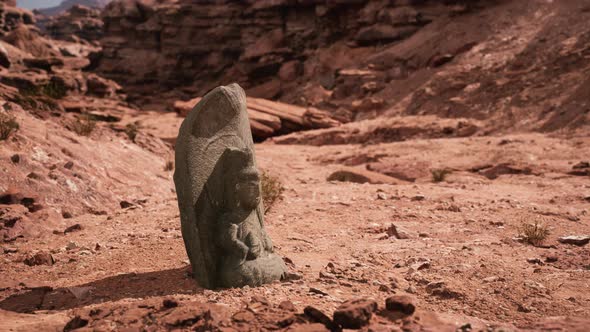 Ancient Statue on the Rocks Desert