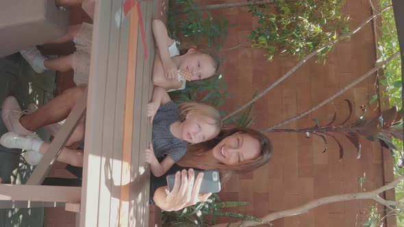 Mother Making Selfie with Her Children