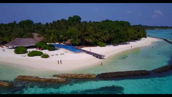 Aerial nature of tranquil bay beach holiday by aqua blue ocean and white sand background of a daytri