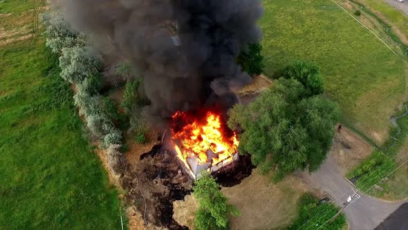 Aerial footage of house burning down