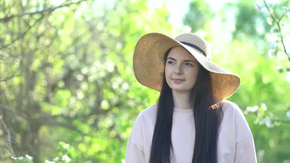 Beauty Young Woman Enjoying Apple Blooming Spring Orchard.