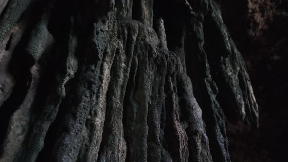 Underground Cave with Stalactite Rock Formations Hanging From Kuza Cave Ceiling