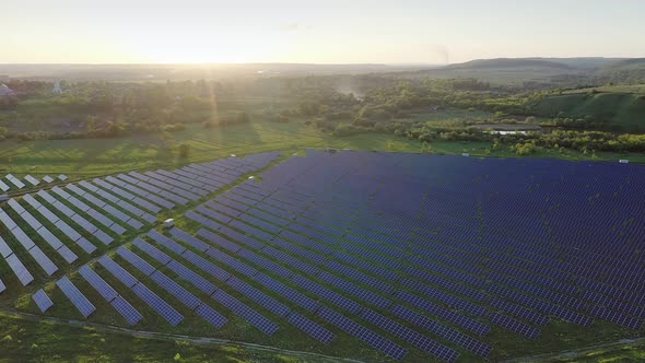 Ecology solar power station panels in the fields green energy at sunset landscape