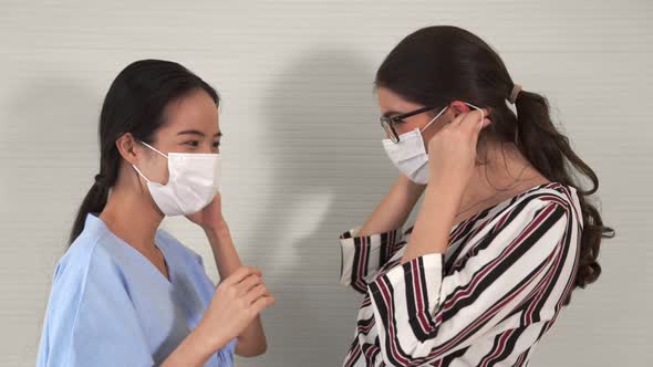 Happy Friends Take Off Face Mask and Hug Each Other Closely Together