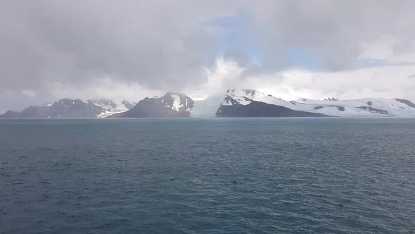 Glacier of Antarctica Far on the Horizon Cloudy Day