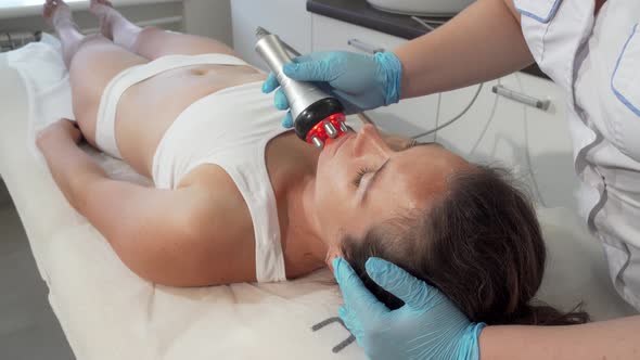 Professional Beautician Doing Rf-lifting on Her Female Client