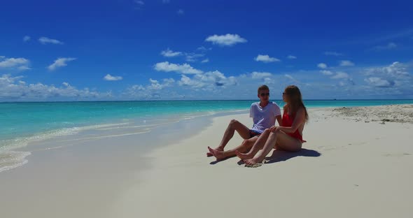 Beautiful couple after marriage in love spend quality time on beach on white sand background 