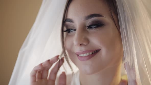 Beautiful and Lovely Bride in Night Gown and Veil. Wedding Morning. Slow Motion