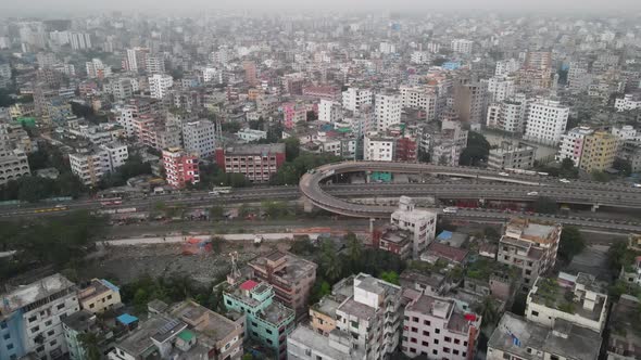 Heavy traffic on highway in Dhaka; smoggy air, aerial view