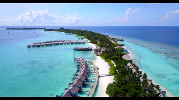 Aerial drone shot seascape of relaxing sea view beach voyage by aqua blue sea with white sandy backg