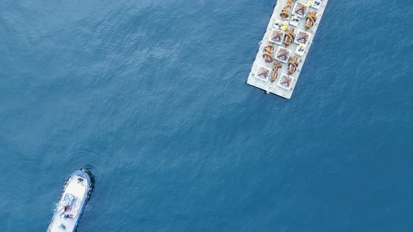 Artificial reef structure on a floating barge ready for installation on the ocean floor. Drone view