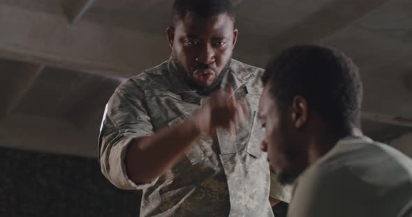 African American Commander Scolding Soldier