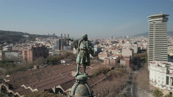 AERIAL: Close Up Circling Columbus Monument in Barcelona, Spain on Beautiful Sunny Day 