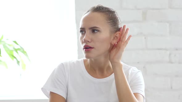 Woman Listen Carefully Hand on Ear Portrait