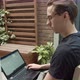 Man using laptop outdoors - VideoHive Item for Sale
