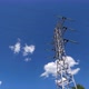 High voltage power line against a blue sky with moving clouds. Timelapse. - VideoHive Item for Sale
