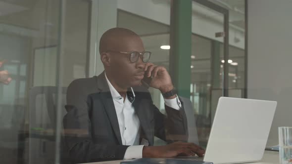 African Businessman Having Telephone Conversation