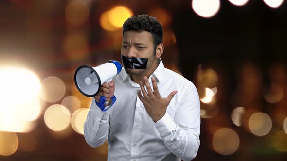 Gagged Man with Megaphone Can Not Speak.