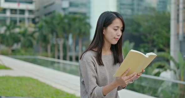 Woman read book at outdoor