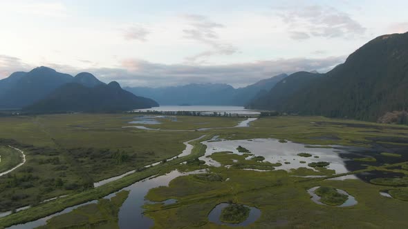 Beautiful Aerial Panoramic View of Canadian Mountain Landscape during a vibrant summer sunset. Taken